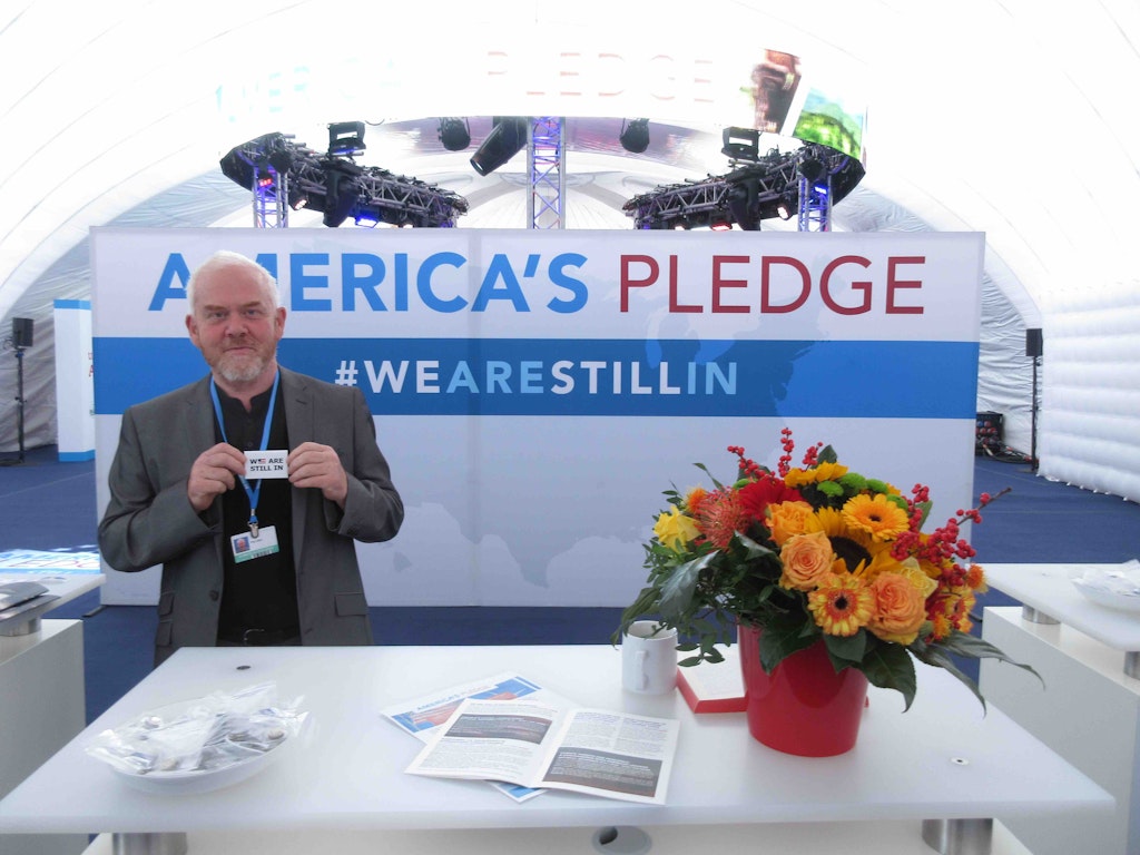 Paul Allen in the pop-up pavillion pledging US action on climate