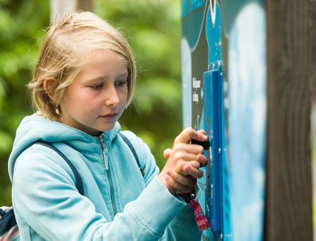 Child looks at an energy display at CAT