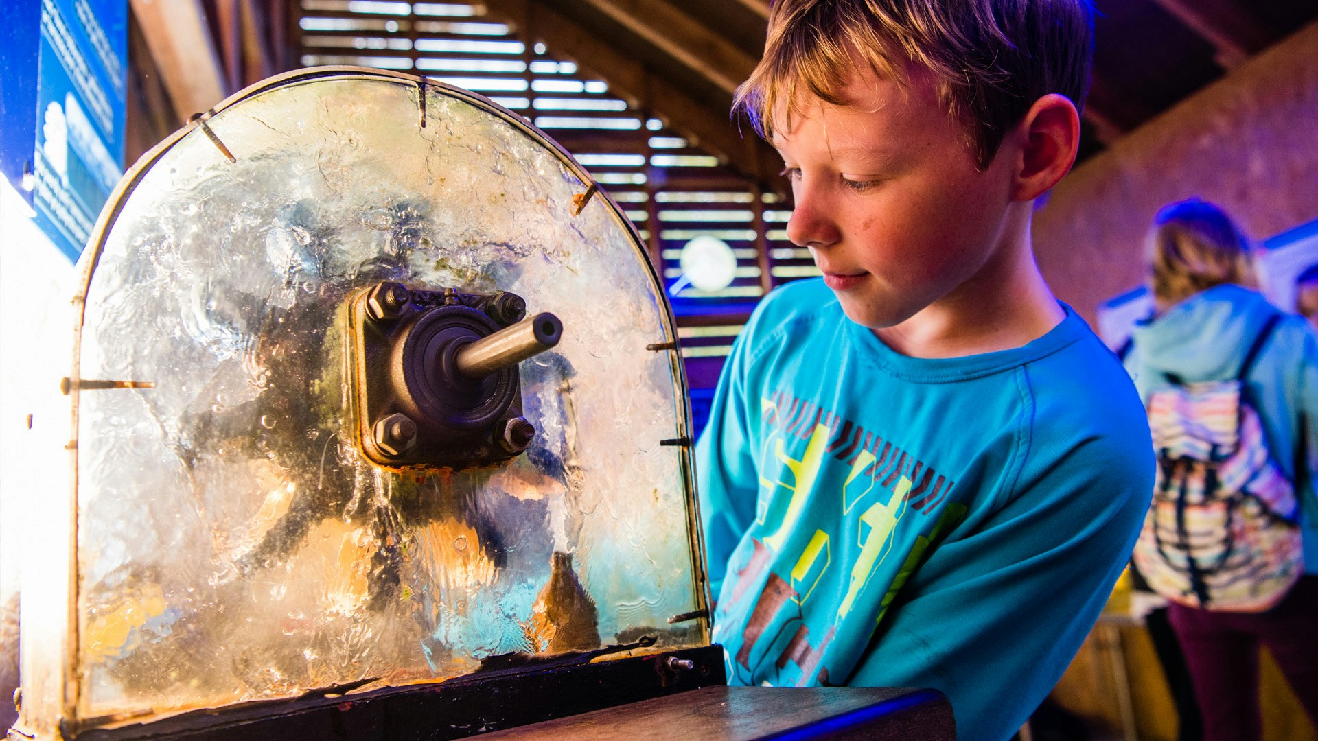 Child looks at the interactive hydro electric display