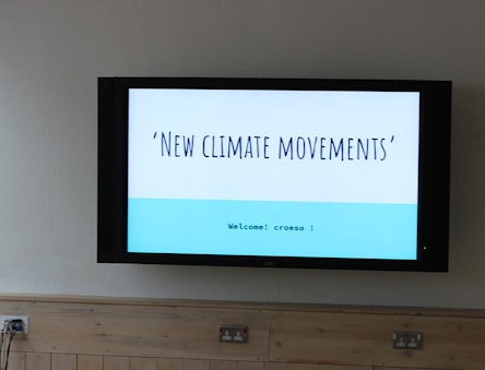 'New climate movements' written on a screen