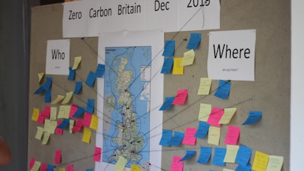 Map with post it notes showing where people have come from on our Zero Carbon Britain Dec course