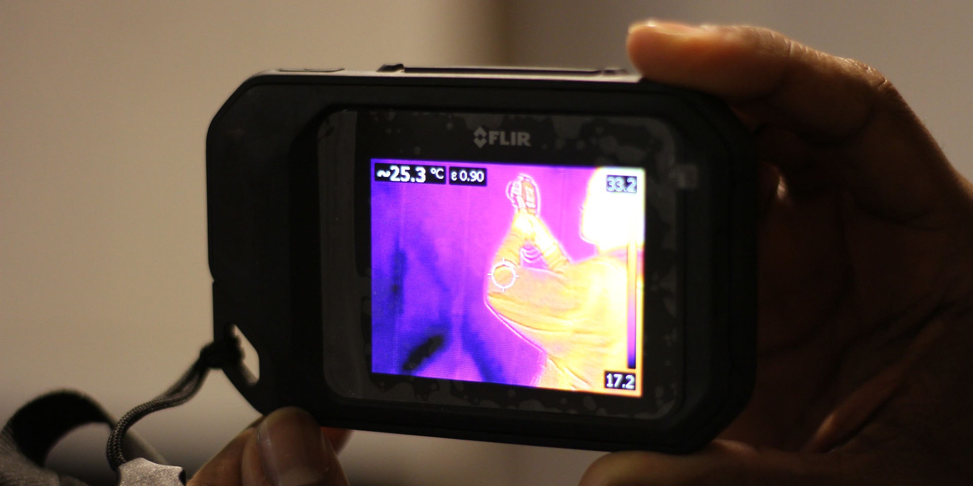 Thermal camera with image of a person on the screen