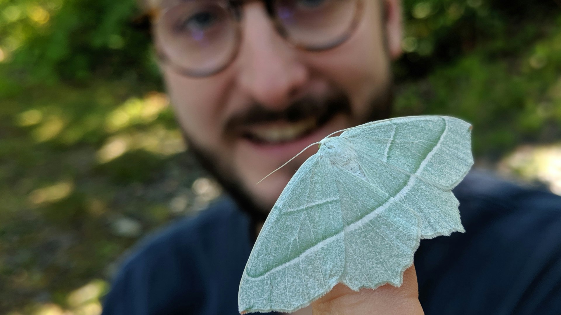 Man holding a moth