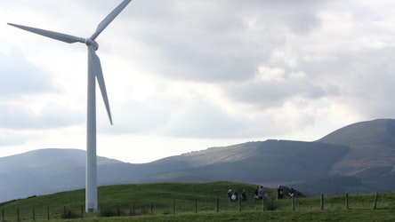 CAT students by a wind turbine