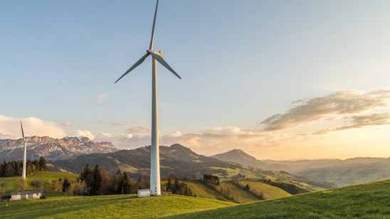 Wind turbine with hills in the background