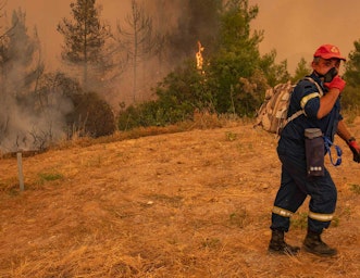 Heatwaves have become more frequent and more intense. Image shows wildfires in Evia Island, Greece, August 2021. Nicolas Economou / Shutterstock