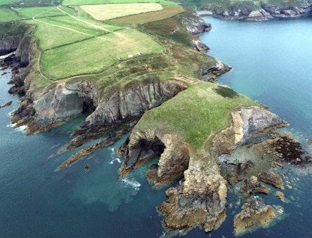 An archaeological excavation supported by CHERISH on the eroding isthmus at Caerfai Iron Age promontory fort, Pembrokeshire.